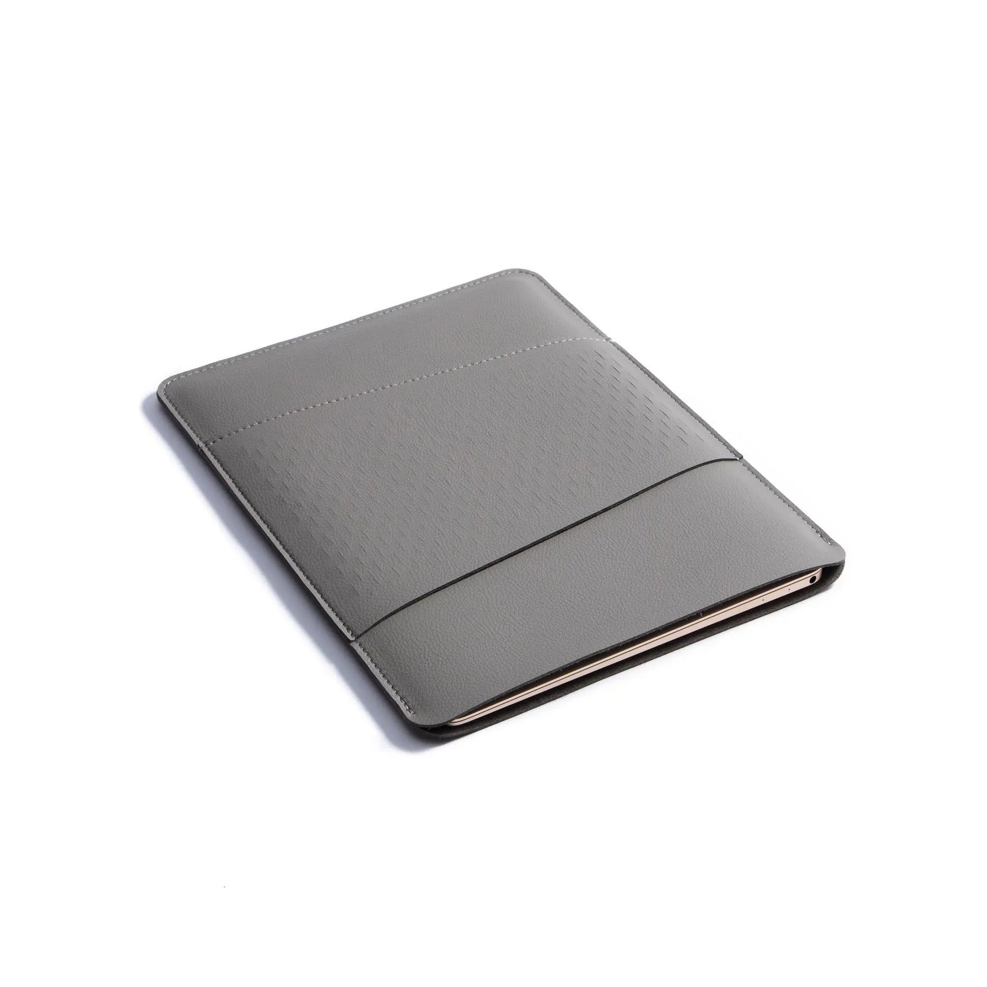 Side view of 2-in-1 slim leather MacBook sleeve - dark gray.