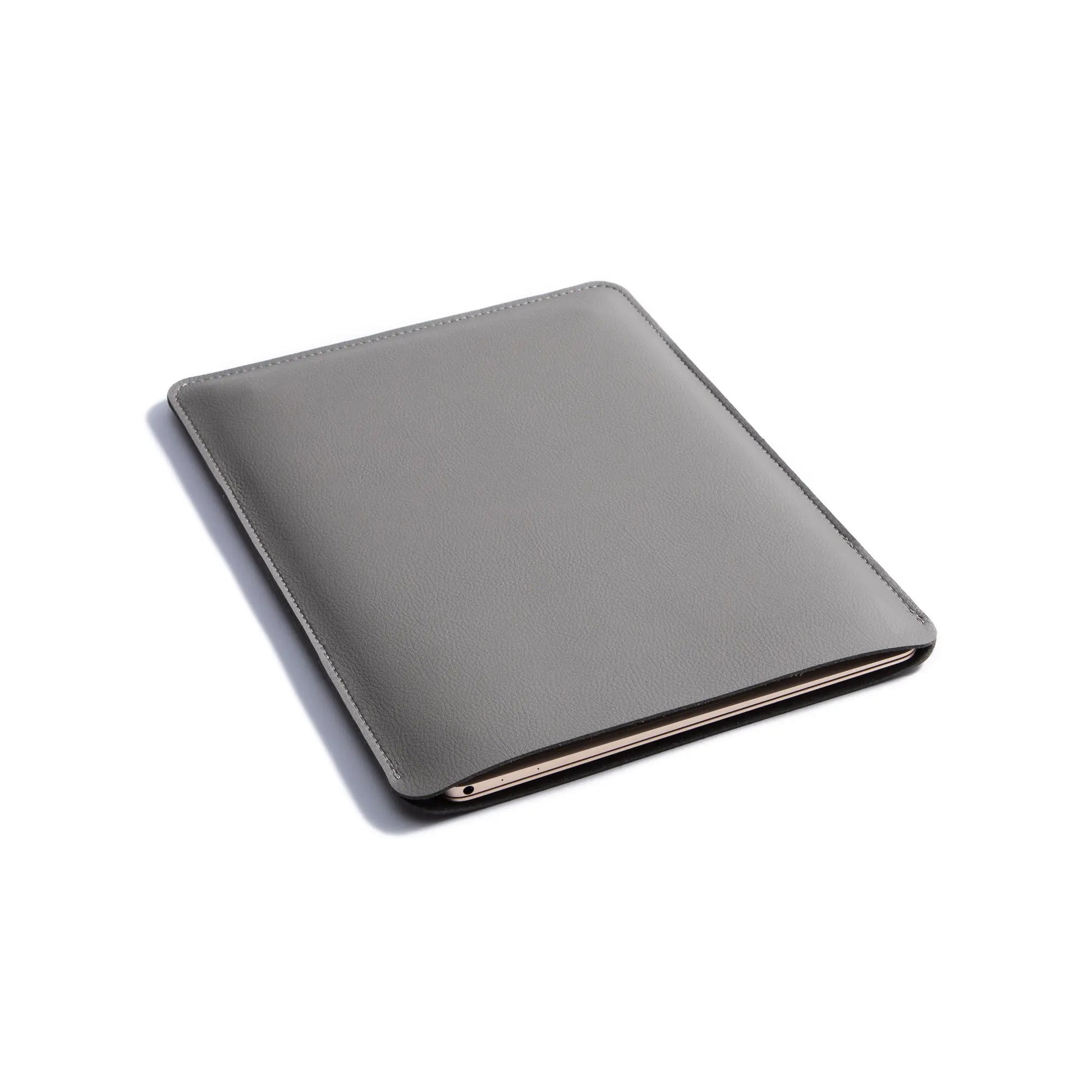 Top view of 2-in-1 slim leather MacBook sleeve - dark gray.