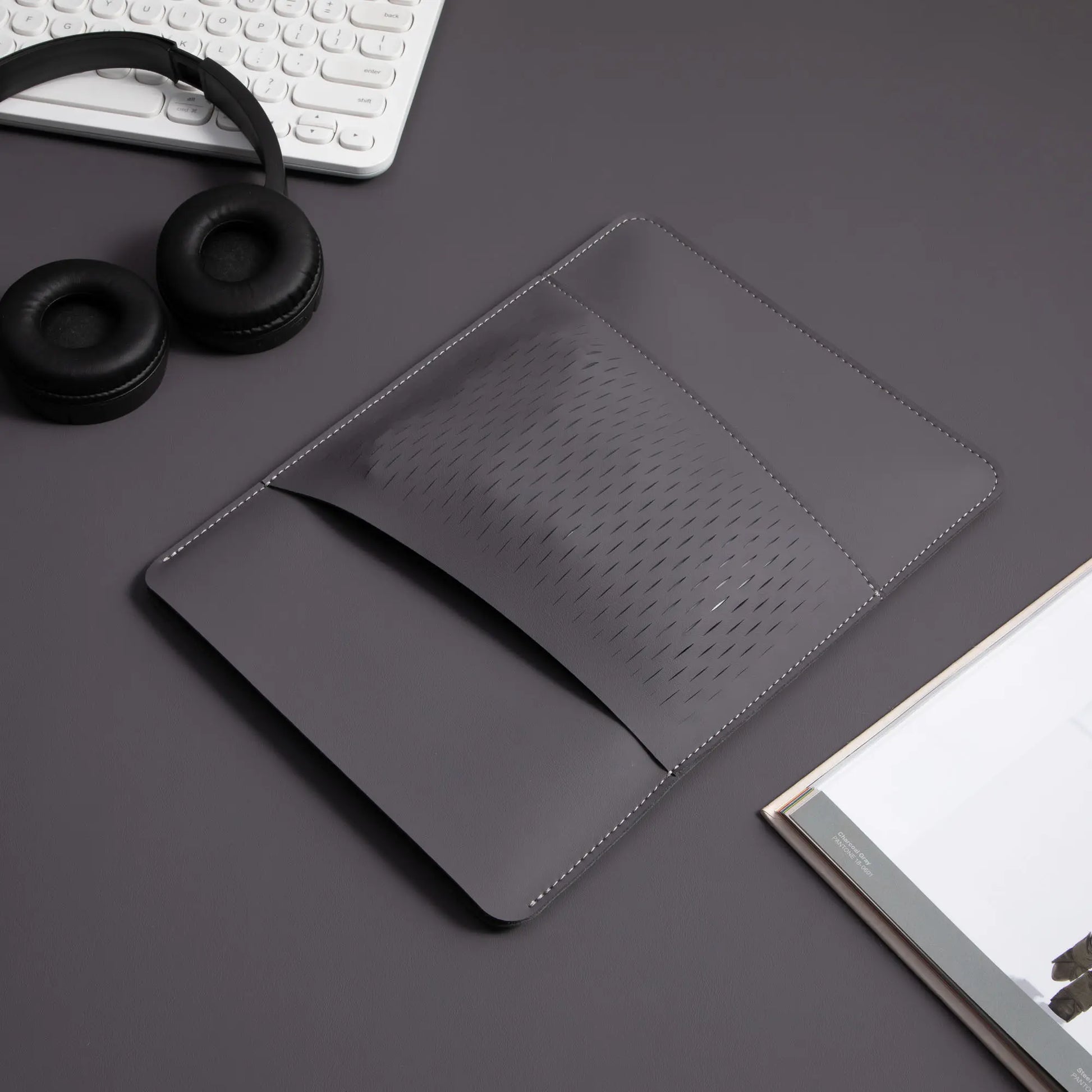 Detail of the honeycomb storage pouch on antibacterial 2-in-1 multifunctional MacBook leather sleeve - vintage gray.