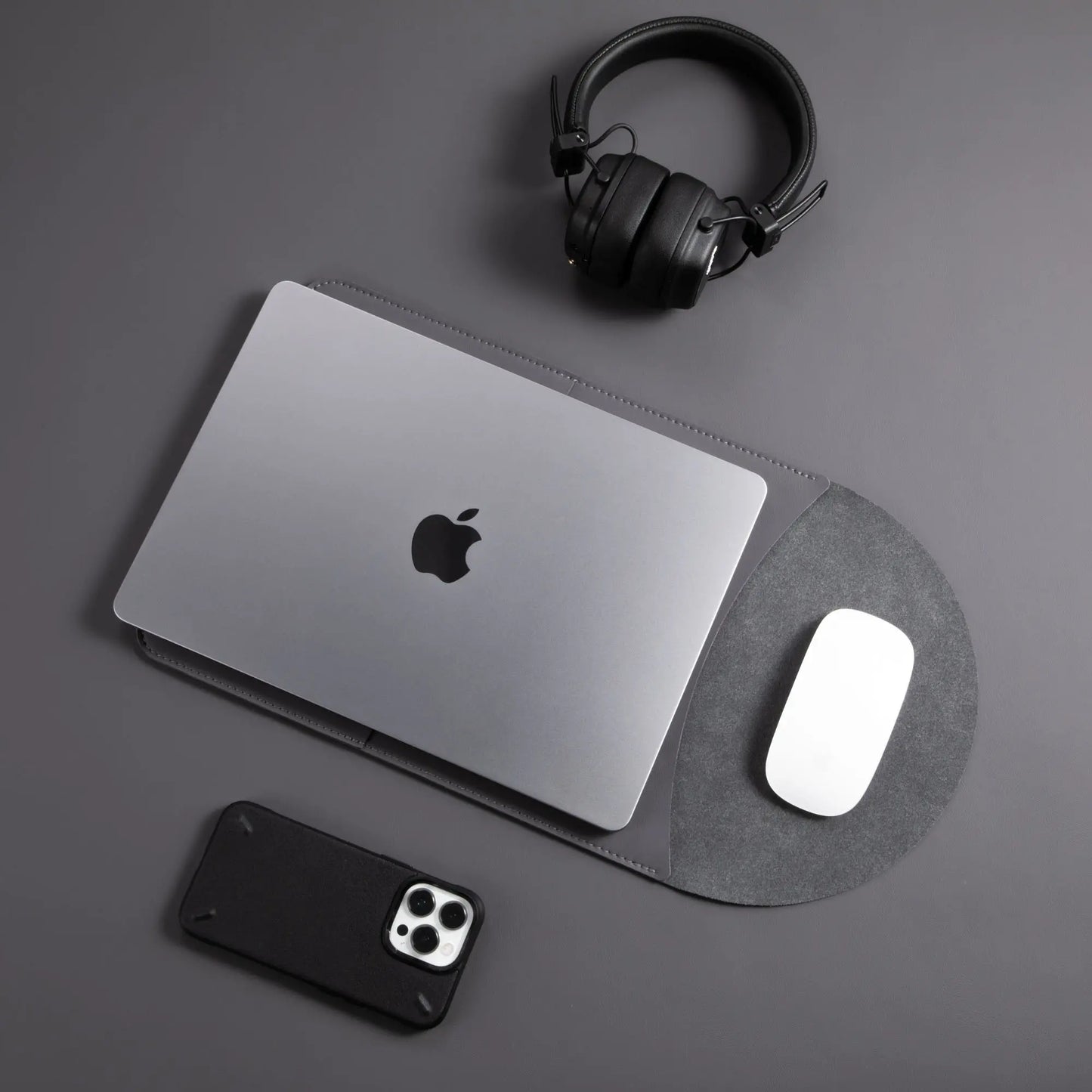 Usage view of antibacterial 3-in-1 vintage gray MacBook leather sleeve with MacBook and Magic Mouse.