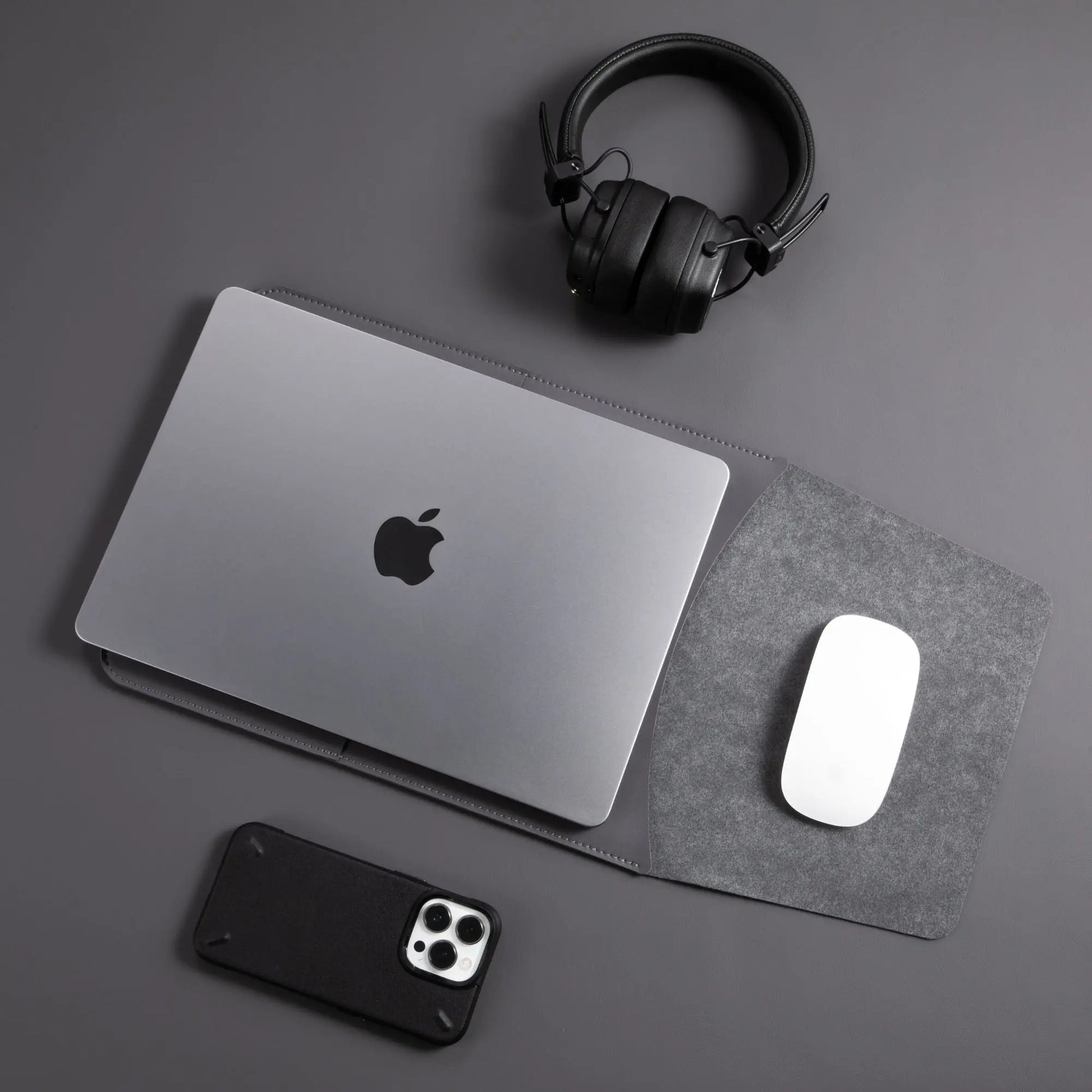 Usage view of antibacterial 3-in-1 vintage gray MacBook leather sleeve with MacBook and Magic Mouse.