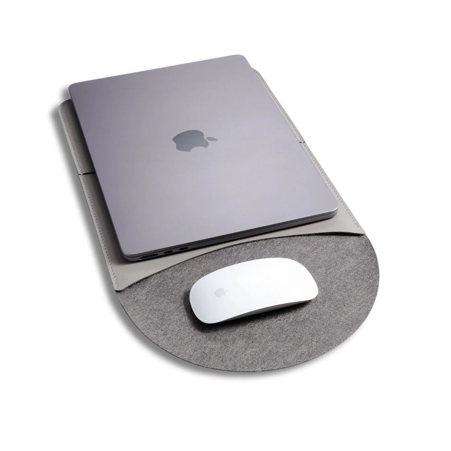 Closeup view of slim 3-in-1 MacBook leather sleeve usage, with built-in round mouse pad - light gray.