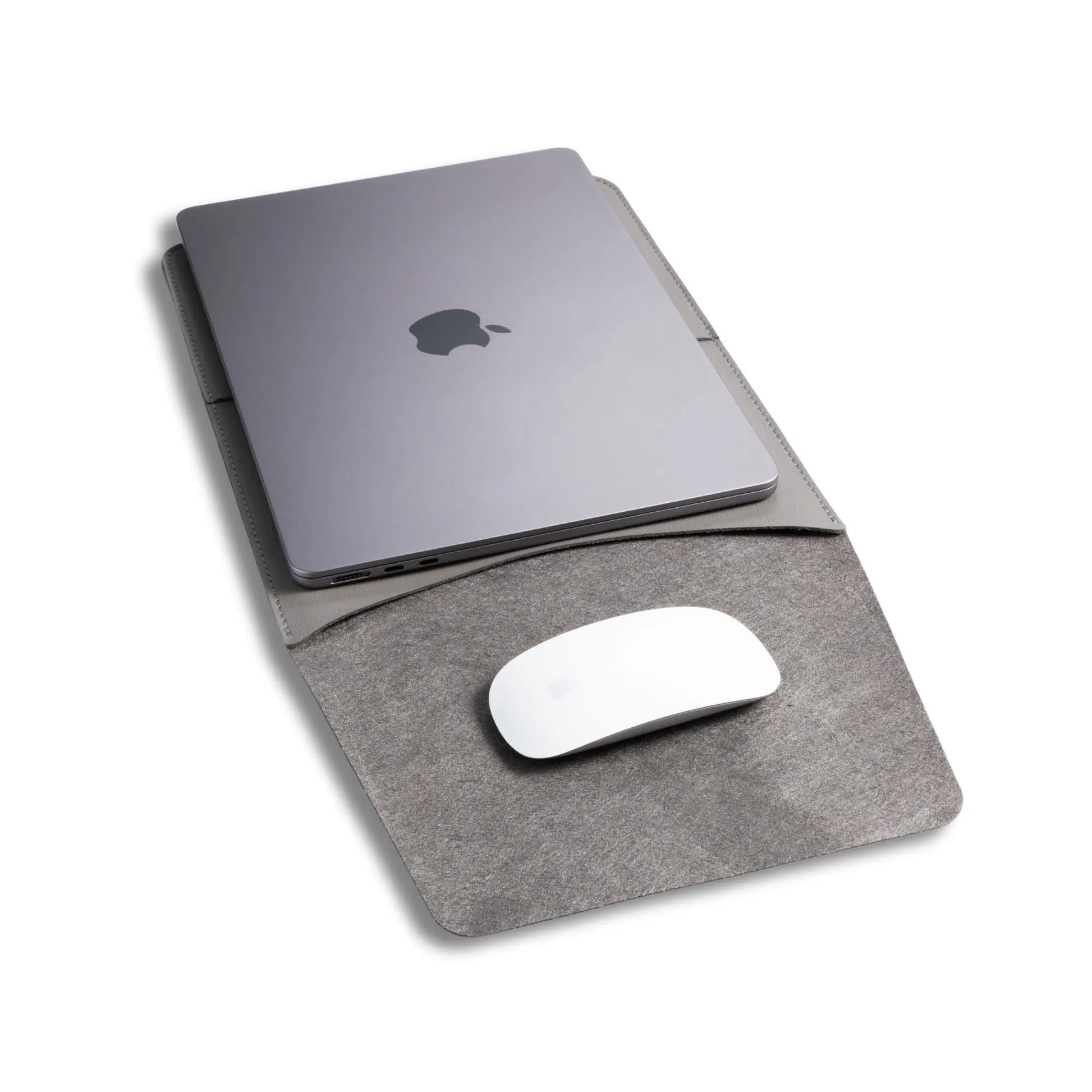 Closeup view of slim 3-in-1 MacBook sleeve usage, with built-in square mouse pad - dark gray.