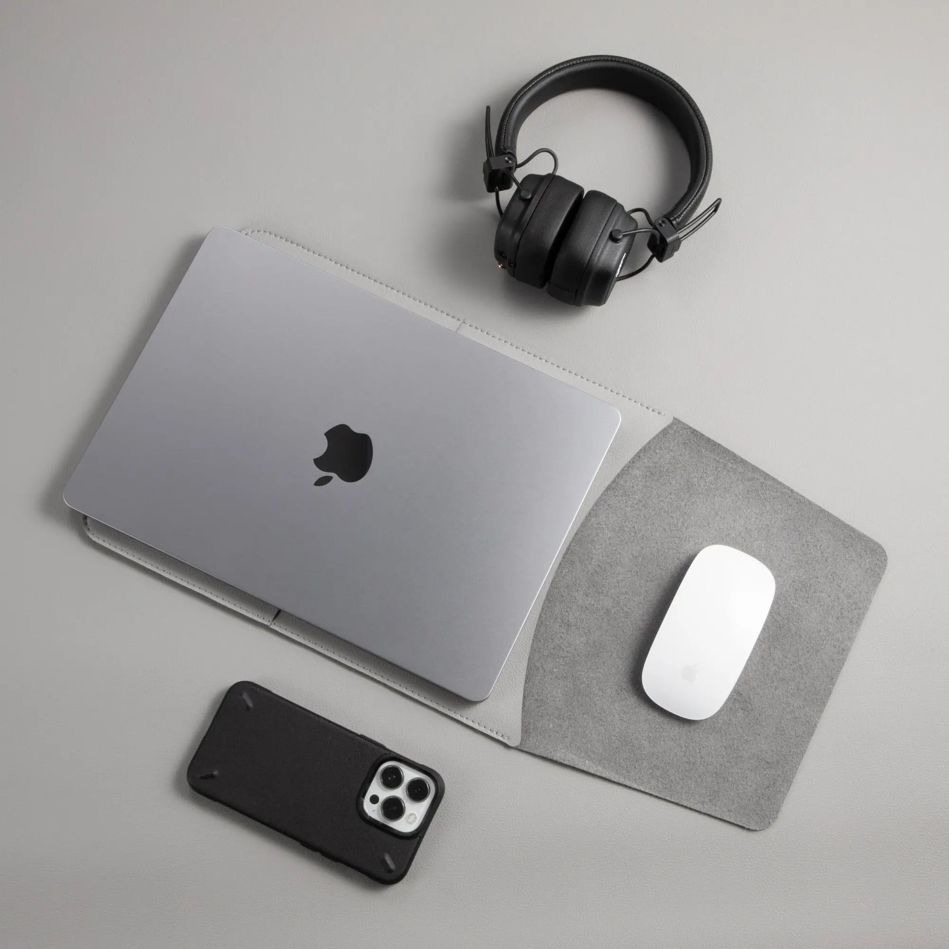 Slim 3-in-1 MacBook sleeve with built-in square mouse pad in use - light gray.